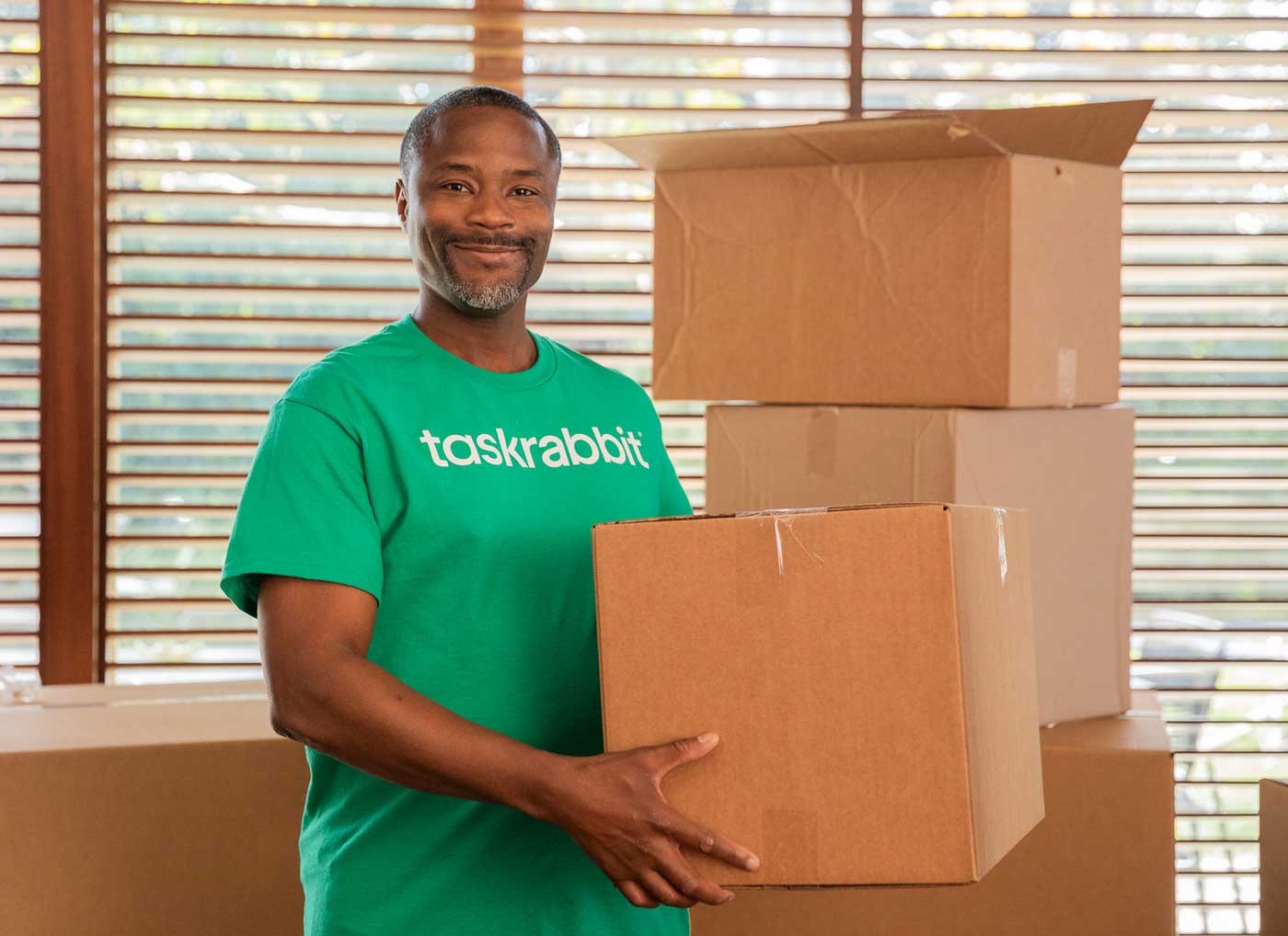 Helper holding boxes